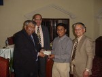 DG handovering Cheque to Rotaract District Council Nepal