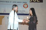 District Secretary Rtn. Siba Bhakta Rajbhandari presenting Best Secretary Award 2006 to Rtr. Nitisha Tamrakar