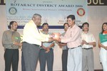 DG Rtn. Swapan Mukherjee presenting Most Dedicated Council Member Award to ZDR Rtr. Shiva Mul 