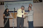 IPDG Rtn. Swapan Mukherjee handovering the token of love to DG Nominee Rtn. Dr. Tika Man Vaidya