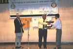 On behalf of Rotaract District Council Nepal, ADRR Rtr. Avash Piya presenting Token of Love to IPDG Rtn. Swapan Mukherjee