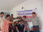 Club Secretary of RC Dillibazar Rtn Binod Kajee Shrestha and Secretary of RTR Club of Dillibazar Rtr Nirajan Malakar  handing over 9  woolen rugs to the President of  Dalit Orphan Children Centre at Mandikatar on February 24 2006.