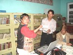 President of RC Dillibazar Rtn Surendra Dhakal  is handing over a cheque of Rs. 5000/- in its regular meeting of March 22 2006 to Mr. Bishnu K Shrestha of Shree Pragatisil Yuva Club Ramechhap as donation to construct community clinic at remote village in Ramechhap.