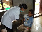 Dr. Smriti checking teeth