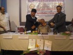 President Rtn. Mangal Man Bajracharya presenting token of love to AG Jitendra Rajbhandari