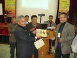 DG Dr. Tika Man Vaidya giving away First Prize to Rotary Club of Patan Durbar Square in Rota Quiz 2009