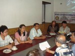 Club members discussing during meeting