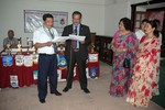 President Rtn. Sargat Vaidya Conducts oath to Incoming President Rtn. Sohan Sundar Shrestha accompanying by two First Lady ( In coming & Out going ) 