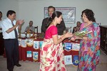 Bouquet presenting to In coming First Lady by Out going First Lady