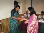 Congratulation to newly inducted member Ms. Minu Shrestha by First Lady Kamal Tara Bajracharya
