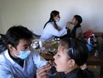 Dr. Sirish & Dr. Rabina engage in Dental camp hold in Godamchour village.