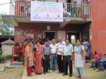 Rotarian and Spouse attending Rheumatic Heart check up camp at Godamchour on 22nd Aug 013 