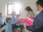 DG Jaya handing over stationery to the student of Balodaya School