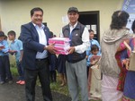 PP Sargat handing stationery to Principle of Balodaya School