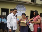 IPP Keshab and President Minu handing over stationery to Balodaya School.