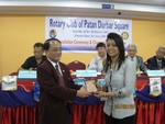 Token of love to Dr. Rabina Joshi Karmacharya by DG Tirtha Man Sakya, for supporting Dental Camp. 