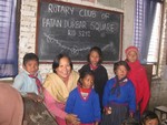 Ann Anita with children of Brick factory in Sano Gawn after distributing warm cloth.