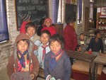 Receiving warm cloth by children of Brick factory in Sano Gawon distributed by RC Patan Durbar Square.