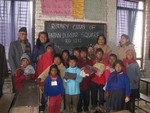 President Bimal and Ann Anita with children of Brick factory in Sano gawon after distribution of warm cloth. 