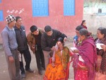 Rtn. Bishwo and Rtn. Surendra helping in vision test in eye camp.