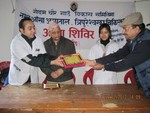 Token of Love to Doctor's team presenting by PE. Rtn. Janak Thapa