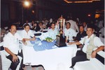 President Rtn. Sargat Vaidya with club member in District Award 2009